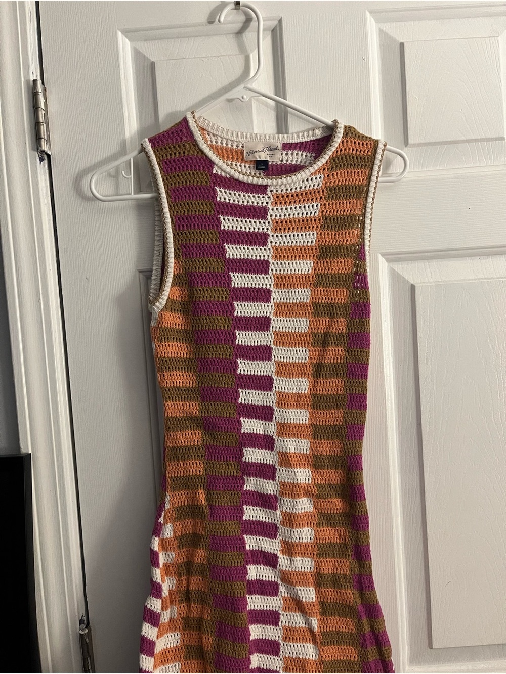 Label and neckline of a knit sweater